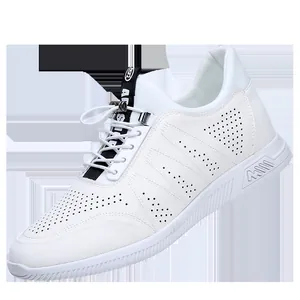 Close-up view of premium white leather breathable sneakers with perforated design details