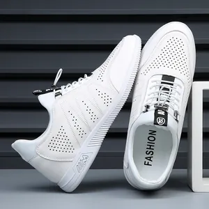 Close-up of white leather casual sneakers with laser-cut breathable perforations