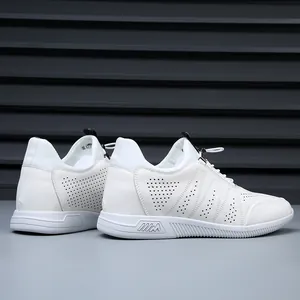 Side view of white leather sneakers with breathable perforations and hidden height increase