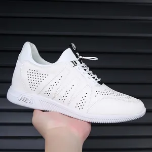 Detailed side view of white breathable leather men's sneakers featuring a hollow design