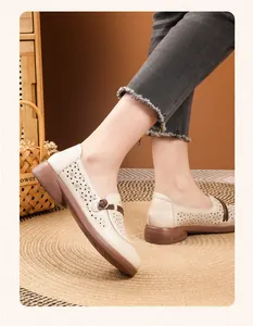Detailed view of breathable hollow-out beige leather loafers for women with soft soles
