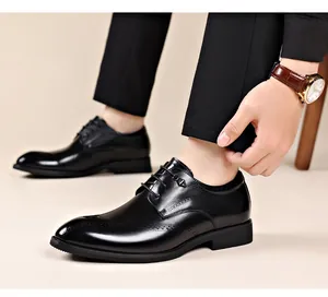 Detail view of black leather brogue shoes with polished finish and lace-up design