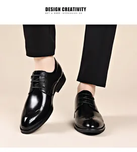 Close-up of black men's business formal leather shoes featuring elegant brogue details