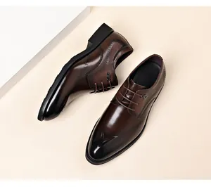 Detailed top view of elegant brown leather brogue business shoes with lace-up design