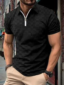 Detail of men's black ice silk polo with jacquard checker pattern and white zipper closure.