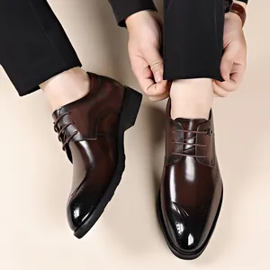 Men's brown leather business dress shoes with elegant brogue detailing and soft sole