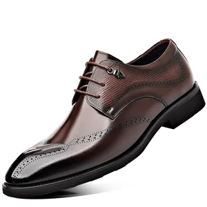 Elegant brown leather business dress shoes featuring classic British brogue carving