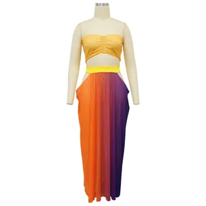 Detail view of women's vibrant beach style tube top and gradient maxi skirt outfit