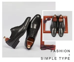 Detailed view of classic black leather cap-toe Oxford shoes for formal business attire