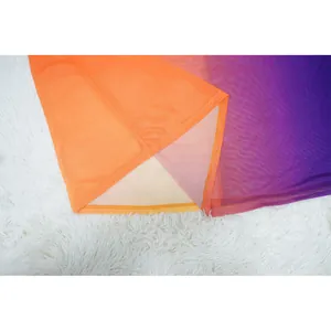 Close-up detail of gradient mesh fabric hem showing fine stitching and vibrant colors