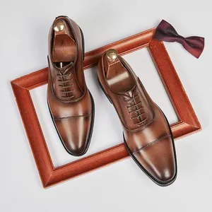 Men's classic brown leather cap-toe Oxford shoes perfect for business formal and wedding wear