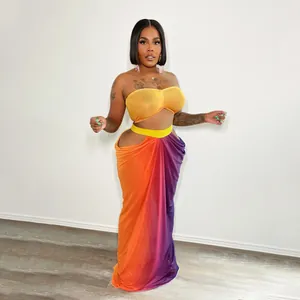 A stylish vibrant orange and purple gradient two-piece beach skirt set for women