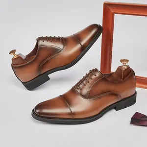 Classic brown leather cap-toe Oxford shoes for men featuring elegant gradient finish