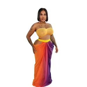 Stunning two-piece beach set with a yellow bandeau top and a gradient maxi skirt.