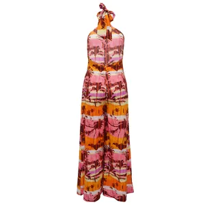 Detailed back view of a halter backless wide-leg jumpsuit with tropical palm print