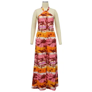 Full length detail of women's halter neck backless jumpsuit with tropical palm tree print