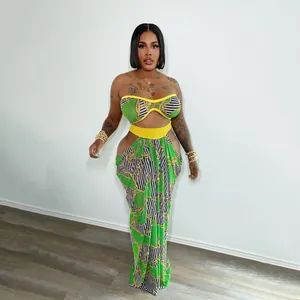 Bohemian beach style two-piece set with vibrant green print tube top and maxi skirt