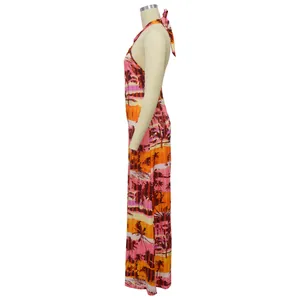 Side view of halter neck backless jumpsuit with tropical palm tree sunset print