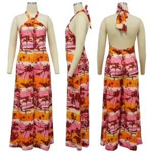 Women's backless halter neck jumpsuit featuring a vibrant orange tropical palm print