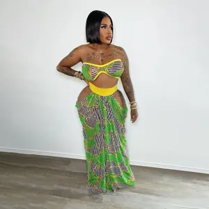 Detailed view of women's beach style two-piece printed tube top and long skirt set.