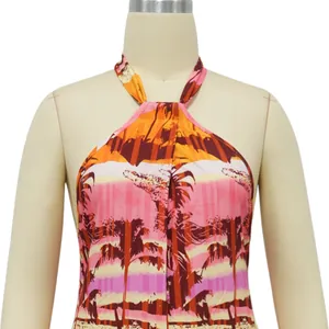 Detailed close-up view of the tropical palm tree print on a stylish halter neck backless jumpsuit