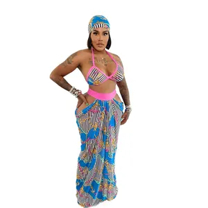 Stylish three-piece beachwear set featuring a blue chain print halter top and maxi skirt