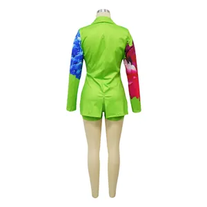 Back view of a lime green floral print blazer and shorts set on a mannequin