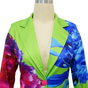 Detail view of colorful floral print blazer with notched lapel and pink button