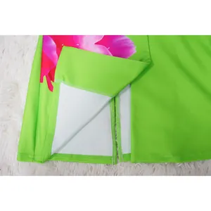 Detail shot of green floral blazer set showing high-quality stitching and hem slit