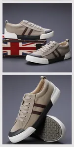 Détail de baskets en toile beige pour hommes avec rayures marron et semelle texturée.