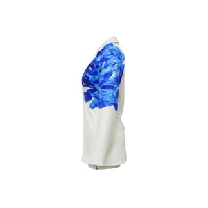 Side view detail of fashion white blazer featuring vibrant blue floral print on the sleeve