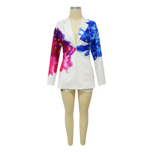 Women's stylish white blazer and shorts set with vibrant blue and pink floral prints