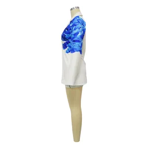 Side view of women's white blazer with blue floral print and matching shorts