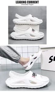 Detail view of men's white breathable beach clogs with a non-slip soft sole