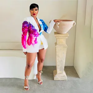 Full body model shot of a white fashion suit featuring vibrant floral print blazer