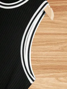 Close-up of neckline and striped armhole detail on men's black knit ribbed tank top