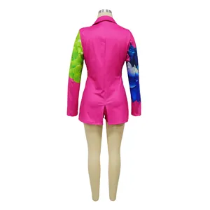 Rear view of a stylish vibrant pink blazer and shorts suit featuring colorful floral printed sleeves
