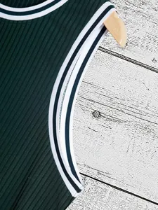 Close-up of a green ribbed knit tank top featuring striped neckline and armhole trim