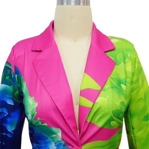 Detailed close-up of colorful floral print blazer with notched lapel on a mannequin