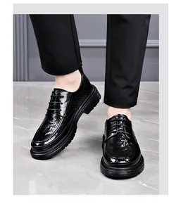Close-up of black breathable hollow leather shoes for men on a gray background