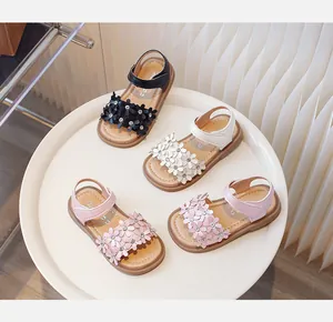 Detailed view of girls floral princess sandals in four colors on a white tray