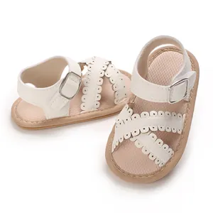 White baby girl sandals with elegant scalloped straps and breathable mesh lining