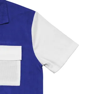 Detail view of men's heavy blue and white corduroy short sleeve shirt with pocket texture.
