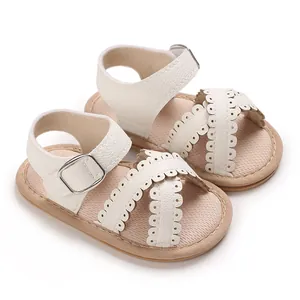 Cream white faux leather baby girl sandals with delicate scalloped edges and buckle