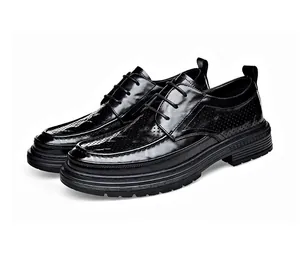 Detailed side view of black breathable leather derby shoes with perforated hollow pattern