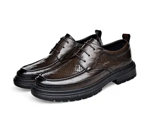 Close-up side view of brown perforated leather oxfords with breathable hollow design and thick sole