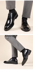 Black crocodile-embossed leather men's wingtip brogues for business or wedding