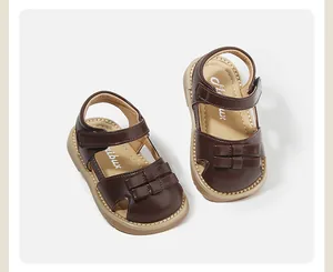 Detail view of brown leather toddler girl sandals featuring cute bow accents and soft insoles