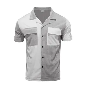 Macro view of a men's color-blocked corduroy shirt with grey and white panels