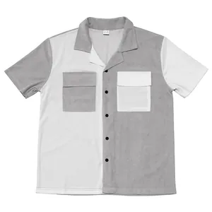 Detailed view of heavy corduroy texture on color-block men's short-sleeve shirt